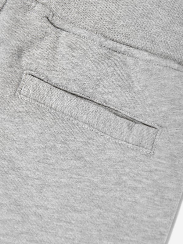 Italian label Stone Island deliver a fresh innovative perspective to their apparel wear. These unisex mélange grey joggers are woven in beautiful organic cotton. They showcase an elasticated waistband, multiple pockets, and the signature detachable Compass badge. Organic Cotton 98, Elastane 2