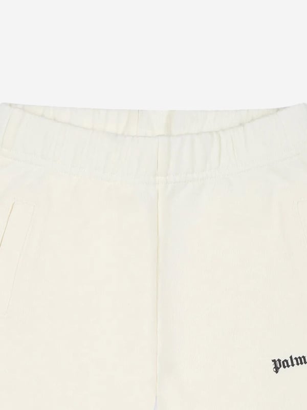 Discover elegance and comfort with the Palm Angels Baby Girls Logo Joggers in Ivory, a pristine addition for the SS2025 season. Perfectly tailored for your little one, these joggers blend luxury with playful charm. Key features include Exquisite Craftsmanship Meticulously crafted, ensuring both durability and comfort. Signature Logo Detailing Features the iconic Palm Angels logo, adding a touch of designer flair. Versatile Ivory Shade Effortlessly coordinates with various outfits, making it a versatile wardrobe staple.Elevate her style with these chic joggers. Order now and infuse glamour into her everyday adventures!