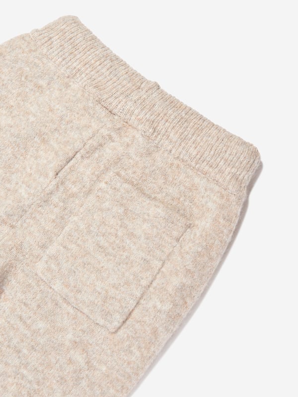 Manchester based label The Couture Club embody innovation and a revitalised perspective on urban streetwear. These unisex beige joggers harmonise urban streetwear with modern technology. Made in refined high quality. They showcase an elasticated waistband, back pocket and the iconic emblem to the side. 75 Polyester, 22 Acrylic, 3 Elastane