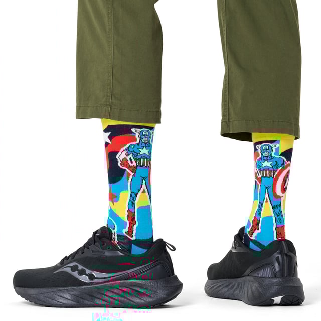 Happy Socks - Marvel Captain America Crew Socks: Step into the world of Marvel with the Captain America Crew Sock, a perfect tribute to the iconic superhero. Featuring a bold design inspired by Captain America’s shield, these socks are a must-have for Marvel fans. Crafted from a comfortable blend of organic cotton, polyamide, and elastane, they offer a snug fit that ensures all-day comfort. The reinforced heel and toe provide added durability, making them perfect for everyday wear. Whether you’re heading to the gym, running errands, or just lounging at home, these socks are designed to keep your feet cozy while showcasing your Marvel pride. Available in size 6-11, they offer a versatile fit for most foot sizes. . These Captain America socks are more than just a practical accessory—they’re a statement piece for Marvel enthusiasts. Add them to your collection or gift them to a fellow superhero fan. Perfect for any occasion, they combine comfort, style, and a love for Marvel heroes. Extra Product Details: Material: 73% Cotton, 25% Polyamide, 2% Elastane Size: 6-11 Design: Captain America shield theme Reinforced heel & toe for durability Care: Machine washable Ideal for: Marvel fans and superhero lovers. Embrace your Marvel spirit with these durable, stylish, and comfortable socks, perfect for everyday wear and a great addition to any Marvel collection!