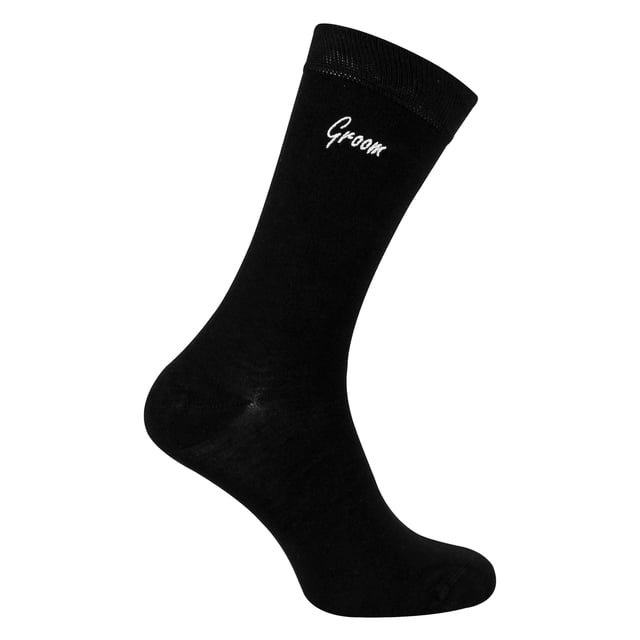 Sock Snob - 1 Pack Mens Wedding Socks: Add a touch of elegance to your wedding day with the Sock Snob 1 Pack Mens Wedding Socks. Designed specifically for key members of the wedding party, these socks are available with personalized labels for Groomsman, Groom, Father of the Groom, Father of the Bride, and Best Man. Choose from classic Navy or Black to perfectly complement your wedding attire. Sized to fit 6-11, these socks provide comfort and style for all-day wear. Made from high-quality, breathable fabric, these socks ensure a soft and luxurious feel, making them ideal for long hours of celebration. Whether you're walking down the aisle, posing for photos, or dancing the night away, these socks are crafted for durability and elegance. These socks also make for a meaningful gift, allowing you to honor the important men in your life with a keepsake they’ll cherish. The timeless design and personalized touch make them suitable for weddings, formal events, or as a thoughtful gesture. Extra Product Details: Styles: Groomsman, Groom, Father of the Groom, Father of the Bride, Best Man Colours: Navy, Black Sizes: 6-11 Material: High-quality, breathable fabric Includes: 1 pair of wedding socks Machine washable for easy care. Elegant, practical, and timeless, Sock Snob Wedding Socks are the perfect choice for your special day. Celebrate in comfort and style while creating lasting memories with these premium socks.