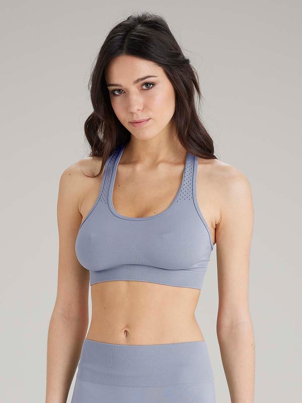 Pretty Polly Active-Wear Crop Top is a seamless top which features a patterned mesh panels detail around the neck line for breathability and a racer back design. Perfect for Yoga or Pilates or just relaxing at home. The fabric is soft and comfortable and is predominantly made from recycled yarn.