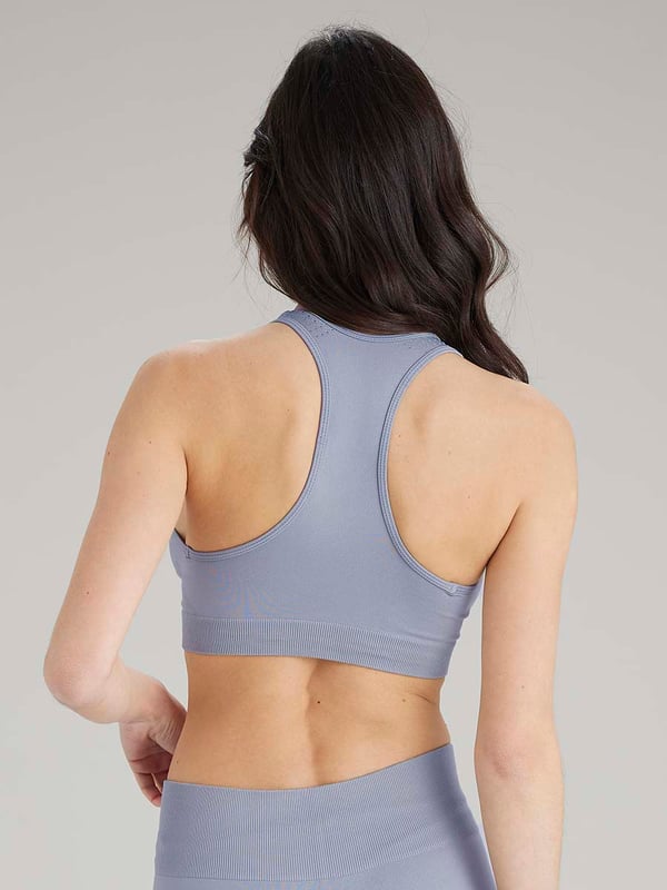 Pretty Polly Active-Wear Crop Top is a seamless top which features a patterned mesh panels detail around the neck line for breathability and a racer back design. Perfect for Yoga or Pilates or just relaxing at home. The fabric is soft and comfortable and is predominantly made from recycled yarn.