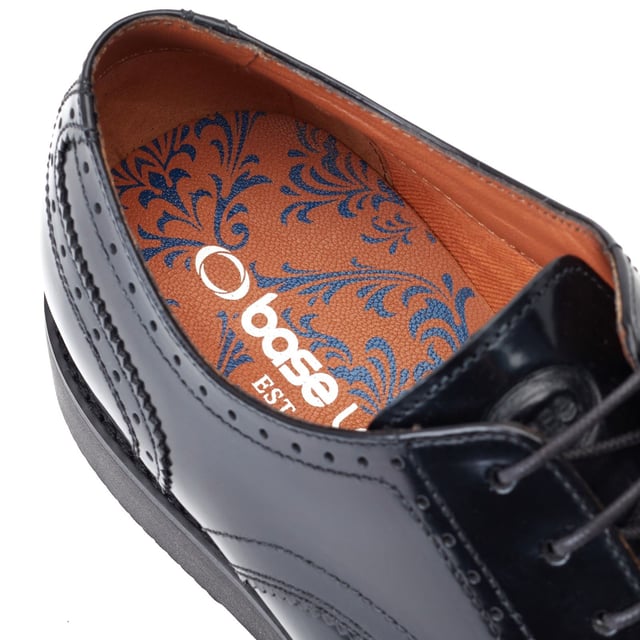 Classic British styling meets modern streetwear this men's brogue shoe from Base London has been crafted with premium leather uppers and is firmly poised on a rubber wedge sole containing a luxurious Ortholite cushioned footbed.