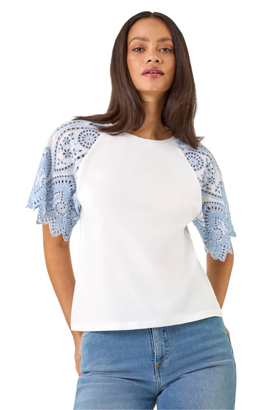 Dusk Broderie Contrast Sleeve Top from Roman. Give your casual wardrobe a stylish update with this contrast sleeve top. Featuring a timeless round neckline and short raglan sleeves with a stunning broderie contrast design. Crafted from a soft, breathable cotton fabric perfect for the Spring Summer season, this top finishes in a flattering tee shape. Pair with a denim jacket and jeggings for a complete look!