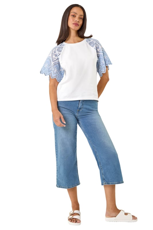 Dusk Broderie Contrast Sleeve Top from Roman. Give your casual wardrobe a stylish update with this contrast sleeve top. Featuring a timeless round neckline and short raglan sleeves with a stunning broderie contrast design. Crafted from a soft, breathable cotton fabric perfect for the Spring Summer season, this top finishes in a flattering tee shape. Pair with a denim jacket and jeggings for a complete look!