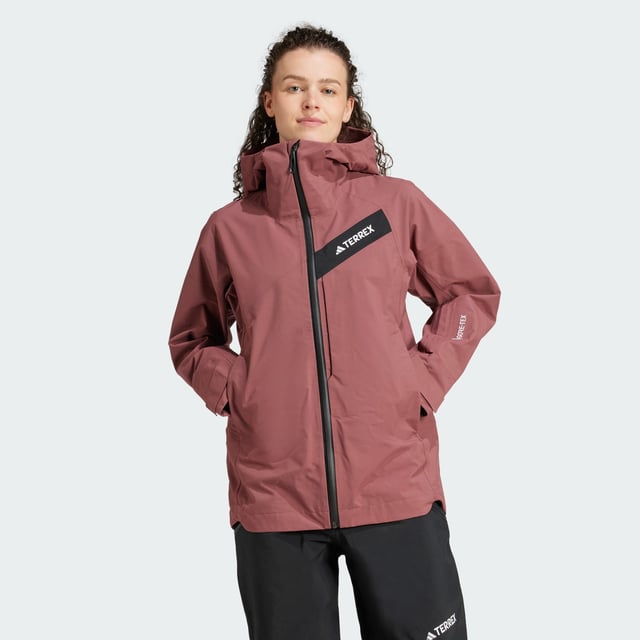 Float through powder and explore the backcountry in a jacket that gives you the freedom to roam. This adidas Terrex ski shell features three-layer GORE-TEX construction with the soft, easy-moving feel of C-Knit backer. Made for layering to match the conditions, it seals out snow, wind and rain while maintaining a lightweight feel and allowing your body to breathe as you search for fresh tracks. A helmet-compatible hood and inner cuffs with thumb loops offer extra coverage on deep, stormy days, while zip pockets keep essentials secure. Open the underarm vents for air as you skin up for the next run. This product is made with at least 70% recycled materials. By reusing materials that have already been created, adidas help to reduce waste and our reliance on finite resources and reduce the footprint of the products adidas make.  -