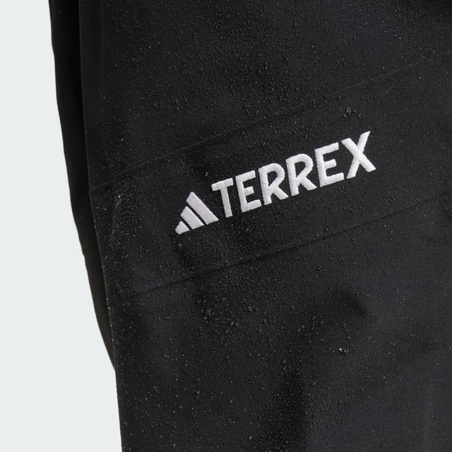 Ride the resort and explore the backcountry in bib pants that give you the freedom to roam. These adidas Terrex snow bibs feature three-layer GORE-TEX construction and the soft, easy-moving feel of C-Knit backer. Made for layering to match the conditions, they offer breathable, storm-sealing coverage while maintaining a lightweight feel and a full range of motion. Reinforced cuffs hold up to ski edges, while built-in boot gaiters seal out snow. Stretch flooce in the back panel maintains an unrestricted range of motion and adds warmth where needed. Two-way leg zips offer venting on the uptrack and make for easy on-and-off, while a drop seat makes for easy bathroom breaks. A mix of pockets, including two thigh pockets and an internal phone pocket, keep must-have stuff close and secure.This product is made with at least 70% recycled materials. By reusing materials that have already been created, adidas help to reduce waste and our reliance on finite resources and reduce the footprint of