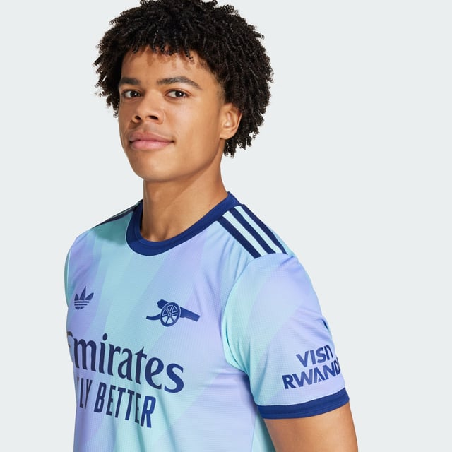 A fresh take on football heritage. Standing out in lilac and aqua, this Arsenal third authentic jersey pairs a bold cannon badge with an iconic adidas Trefoil. The result? A vibrant look that will add colour to dressing rooms, away ends and post-game celebrations. HEAT.RDY and lightweight details make for lively performances on the pitch.This product is made with 100% recycled materials. By reusing materials that have already been created, adidas help to reduce waste and our reliance on finite resources and reduce the footprint of the products adidas make.  - Slim fit - Flat-knit crewneck - 100% polyester (recycled) - Soft fabric - HEAT.RDY - Flat-knit cuffs - Arsenal heat-applied crest  Shipped by adidas