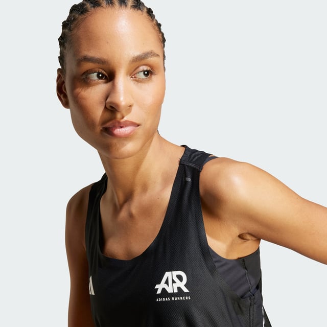 Run with the adidas community every time you pull on this running singlet. It's celebrates that clarity and connection that running fosters, and it keeps you comfortable as you chase your goals. CLIMACOOL wicks and disperses sweat for cool, dry and distraction-free performance, so you feel good on easy miles or race day.CLIMACOOL helps you manage sweat with materials that wick and manage sweat quickly. Its fast-dry fibres give you a fresh-skin feel.This product is made with at least 70% recycled materials. By reusing materials that have already been created, adidas help to reduce waste and our reliance on finite resources and reduce the footprint of the products adidas make.  - Regular fit - Round neckline - 86% polyester (recycled), 14% elastane - CLIMACOOL - Racer back - Reflective logos  Shipped by adidas