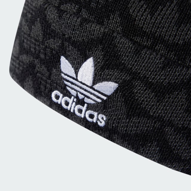Monogram Beanie Stay stylish while keeping warm. This adidas Monogram Beanie features an allover Trefoil print and contrasting Trefoil logo embroidery for a bold yet versatile look. Made of acrylic knit, it provides cosy comfort on breezy days. The fold-up cuff allows you to adjust the fit and switch up your style. - One size fits most - 96% acrylic, 3% nylon, 1% elastane - Fold-up cuff Shipped by adidas