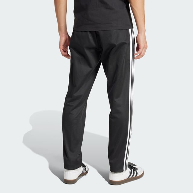 Part of a special collection that commemorates a century of Colo-Colo football. These adidas track pants show off a vintage club badge and iconic Trefoil for a look rooted firmly in football's past. Cut for a slim fit from soft piqué fabric, they'll keep you comfortable in a beloved 3-Stripes silhouette.  - Slim fit - Elastic waist with drawcord - 52% cotton, 48% polyester (recycled) - Front pockets - Colo-Colo crest  Shipped by adidas