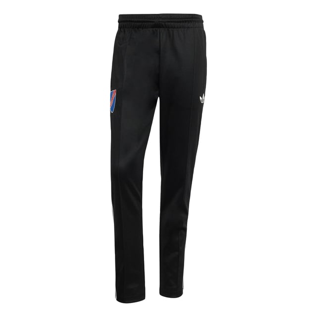 Part of a special collection that commemorates a century of Colo-Colo football. These adidas track pants show off a vintage club badge and iconic Trefoil for a look rooted firmly in football's past. Cut for a slim fit from soft piqué fabric, they'll keep you comfortable in a beloved 3-Stripes silhouette.  - Slim fit - Elastic waist with drawcord - 52% cotton, 48% polyester (recycled) - Front pockets - Colo-Colo crest  Shipped by adidas