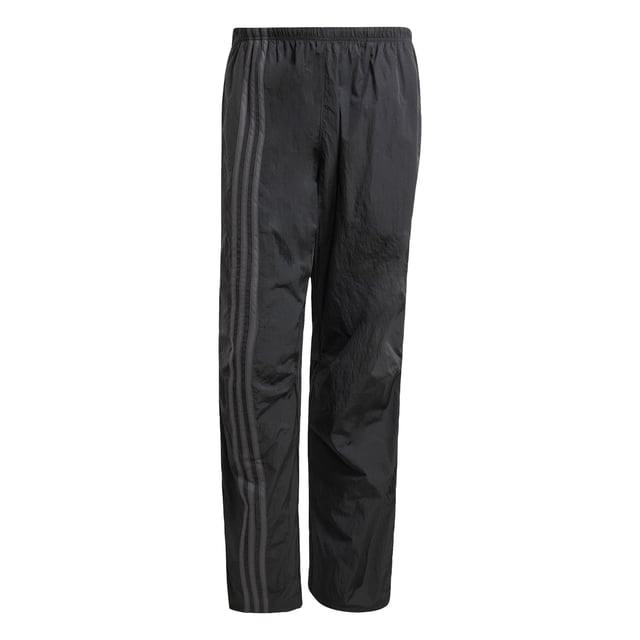 Inspired by the 2000s-era archive, these track pants from adidas give you a minimalist look with maximum impact. Long zippers along the sides with airy mesh underneath keep you comfortable with fashion in focus from the moment you pull them on. They have a loose fit with woven fabric that's lightweight yet durable. A floating Trefoil and 3-Stripes down the right leg show your allegiance to the brand with sport heritage.  - Loose fit - Drawcord on elastic waist - 100% polyamide (recycled) - Side-panel zips with mesh underneath  Shipped by adidas