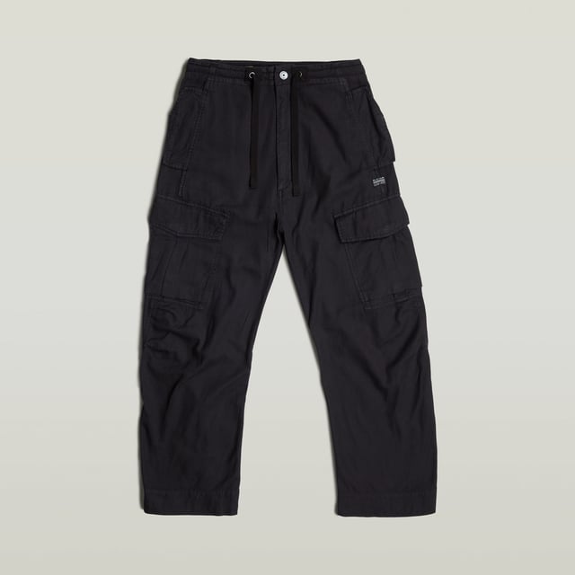 Zip fly and woven tape. Reversed flap pockets at the waist, flap pocket at the back, hidden snap buttons. Flap pockets with snap buttons at the side, straps at the edge. Option for tighter width at the ankle, close tab with snap button. Button & zip closure. High waist. Cargo pants Summer Snow are designed in a loose fit offering a zip fly with an additional drawcord. Waist pockets with a reverse flap offer a hidden snap button. Also at the thigh and back, flap pockets are created. The snaps at the ankles allow for a tighter cuff. 50% Cotton, 50% Recycled cotton. Rigid. Twill woven. Loose