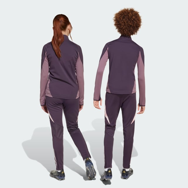 Show your fandom while you work on your fitness. These juniors' adidas Arsenal training pants will keep you feeling dry through every rep thanks to moisture-managing AEROREADY. The slim, tailored fit provides ease-of-movement for extra agility on the field. A club badge on the leg inspires your passion for football perfection.This product is made with 100% recycled materials. By reusing materials that have already been created, adidas help to reduce waste and our reliance on finite resources and reduce the footprint of the products adidas make.  - Slim fit - Drawcord on elastic waist - 100% polyester (recycled) - AEROREADY - Front zip pockets - Ankle zips - Arsenal heat-applied crest  Shipped by adidas