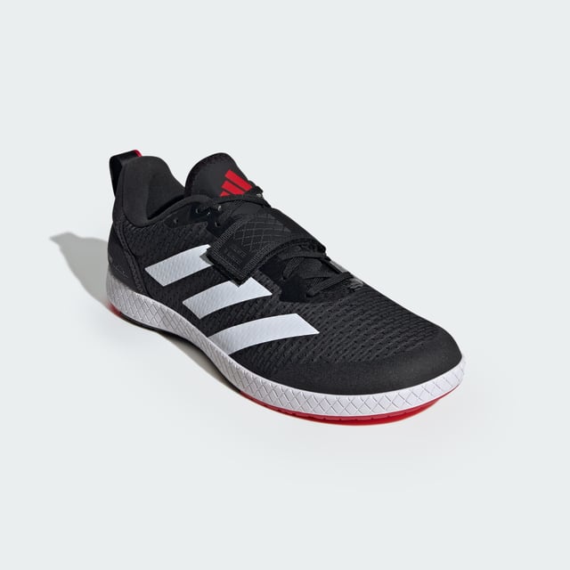 The Total Weightlifting Shoes Made for no-nonsense lifts, these adidas weightlifting shoes have a zero heel raise to create the low-to-the-ground stance preferred by many deadlifters. The combination of a wide strap and lacing offers uncompromising lockdown and a roomy toe box ensures you remain stable and comfortable under heavy weights. Underneath, a rubber outsole offers consistent contact with multiple surfaces.This product features at least 20% recycled materials. By reusing materials that have already been created, adidas help to reduce waste and our reliance on finite resources and reduce the footprint of the products adidas make. - Regular fit - Lace closure with hook-and-loop strap - Textile upper - Rubber outsole - Heel lift: 0 mm - Contains at least 20% recycled content Shipped by adidas