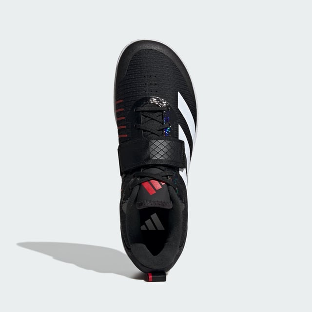 The Total Weightlifting Shoes Made for no-nonsense lifts, these adidas weightlifting shoes have a zero heel raise to create the low-to-the-ground stance preferred by many deadlifters. The combination of a wide strap and lacing offers uncompromising lockdown and a roomy toe box ensures you remain stable and comfortable under heavy weights. Underneath, a rubber outsole offers consistent contact with multiple surfaces.This product features at least 20% recycled materials. By reusing materials that have already been created, adidas help to reduce waste and our reliance on finite resources and reduce the footprint of the products adidas make. - Regular fit - Lace closure with hook-and-loop strap - Textile upper - Rubber outsole - Heel lift: 0 mm - Contains at least 20% recycled content Shipped by adidas