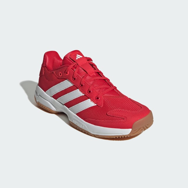 Level up your indoor game. These juniors' adidas shoes provide stability and power with every move. A breathable mesh upper keeps feet feeling fresh while the Torsion System adds support for quick changes in direction. Adiprene+ cushioning in the forefoot absorbs impact and returns energy, fuelling explosive starts and stops. An Adiwear outsole grips the court without leaving marks. With a design inspired by the highly-regarded Stabil 16, these shoes give you the confidence to go after your goals. This product features at least 20% recycled materials. By reusing materials that have already been created, adidas help to reduce waste and our reliance on finite resources and reduce the footprint of the products adidas make.  - Regular fit - Lace closure - Breathable mesh upper - Textile lining - Adiprene+ cushioning - Torsion System - Non-marking Adiwear outsole - Contains at least 20% recycled content  Shipped by adidas