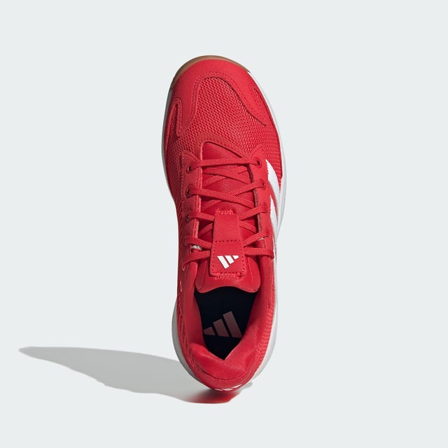 Level up your indoor game. These juniors' adidas shoes provide stability and power with every move. A breathable mesh upper keeps feet feeling fresh while the Torsion System adds support for quick changes in direction. Adiprene+ cushioning in the forefoot absorbs impact and returns energy, fuelling explosive starts and stops. An Adiwear outsole grips the court without leaving marks. With a design inspired by the highly-regarded Stabil 16, these shoes give you the confidence to go after your goals. This product features at least 20% recycled materials. By reusing materials that have already been created, adidas help to reduce waste and our reliance on finite resources and reduce the footprint of the products adidas make.  - Regular fit - Lace closure - Breathable mesh upper - Textile lining - Adiprene+ cushioning - Torsion System - Non-marking Adiwear outsole - Contains at least 20% recycled content  Shipped by adidas