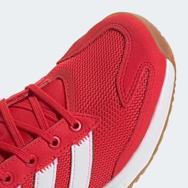 Level up your indoor game. These juniors' adidas shoes provide stability and power with every move. A breathable mesh upper keeps feet feeling fresh while the Torsion System adds support for quick changes in direction. Adiprene+ cushioning in the forefoot absorbs impact and returns energy, fuelling explosive starts and stops. An Adiwear outsole grips the court without leaving marks. With a design inspired by the highly-regarded Stabil 16, these shoes give you the confidence to go after your goals. This product features at least 20% recycled materials. By reusing materials that have already been created, adidas help to reduce waste and our reliance on finite resources and reduce the footprint of the products adidas make.  - Regular fit - Lace closure - Breathable mesh upper - Textile lining - Adiprene+ cushioning - Torsion System - Non-marking Adiwear outsole - Contains at least 20% recycled content  Shipped by adidas