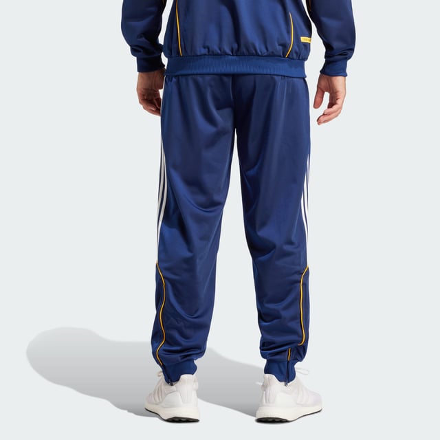 Real Madrid 99/00 Track Pants Relive a memorable European triumph in adidas Real Madrid track pants created to match those worn on the sidelines in the club's successful 99/00 season. Cut for a loose fit that's typical of 1990s football fashion, they layer easily over shorts. Woven onto the leg, that era-appropriate club badge supplies the perfect finish. - Loose fit - Elastic waist with drawcord - 100% polyester (recycled) - Front pockets - Real Madrid crest Shipped by adidas