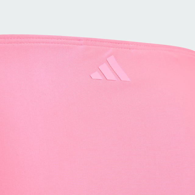 Make a splash in this juniors' adidas bikini. The stylish two-piece suit features an outlined 3 Bar Logo front and centre, showcasing your adidas pride. Underbust elastic provides extra support for swimming and other water sports. This product is made with at least 70% recycled materials. By reusing materials that have already been created, adidas help to reduce waste and our reliance on finite resources and reduce the footprint of the products adidas make.  - Tight fit - 78% polyester (recycled), 22% elastane - Lined gusset - Infinitex fabric  Shipped by adidas