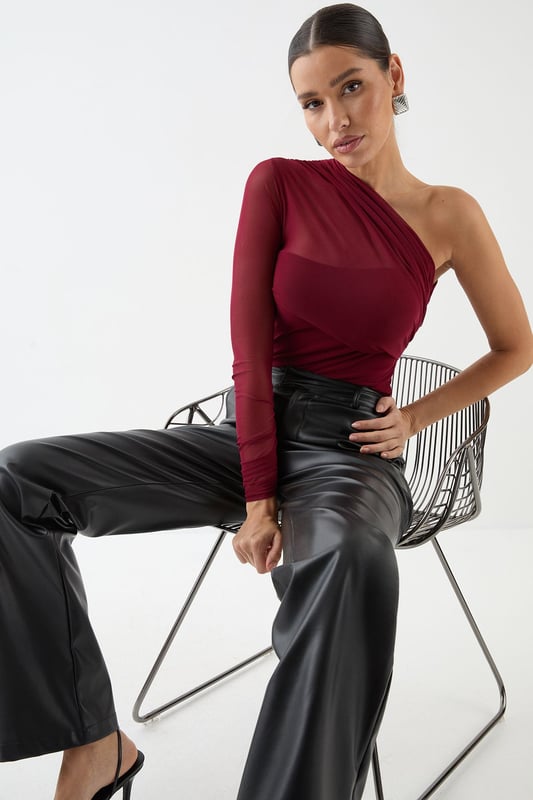 Mesh One Shoulder Bodysuit Striking one-shoulder design for a bold, asymmetric look
Sheer mesh long sleeve adds allure and intrigue
Figure-hugging bodysuit silhouette for a sleek fit
Versatile piece that can be dressed up or down
Perfect for making a statement on nights out
Make heads turn in this daring mesh one-shoulder bodysuit from MissPap. The asymmetric neckline and sheer long sleeve create a captivating contrast, while the form-fitting silhouette accentuates your curves. For a night out on the town, pair it with high-waisted wide-leg jeans and statement heels to create a look that's both edgy and chic. Add some sparkle with bold earrings and a metallic clutch. When it's time to hit the dance floor, swap the jeans for a sleek mini skirt and strappy sandals. This versatile piece can also be layered under a blazer for a more sophisticated ensemble. Whether you're heading to a trendy bar or a pulsing nightclub, this bodysuit ensures you'll be the centre of attention all night long.