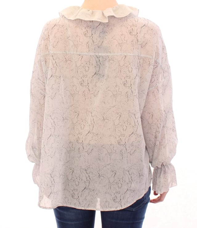 Marca: Vika Gazinskaya.
  Modelo: Blusa Tunica.
  Color: Azul.
  Material: 100% algodon.
  Cierre frontal completo con botones.
  Mangas largas.
  Detalles del logotipo.