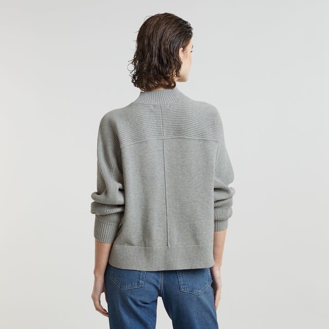 Ribbed mock neck. Shoulder panel proceeds in upper arm panel. Ribbed cuffs and waist. Vertical stripe in 3D at the front and back. Woven G-Star Originals label at the lower front. Zip closure. Boxy Jumper Mock offers a relaxed, loose fit in a shorter length. The ribbed section on the shoulder proceeds in an upper arm panel. The 3D stripe at the front and back adds interest. 95% Cotton, 5% Cashmere. Built-in stretch. Loose