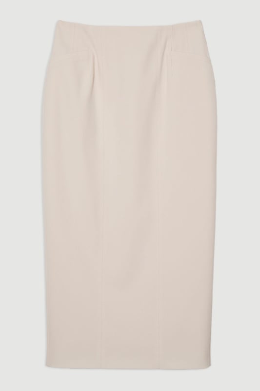 This Karen Millen tailored midi pencil skirt offers the perfect balance of sophistication and practicality for your everyday wardrobe. The compact stretch fabric moulds to your silhouette whilst ensuring all-day comfort and ease of movement. Style with a crisp sleeveless top and strappy sandals for a refined daytime look, or pair with a structured blazer for an effortlessly stylish ensemble perfect for family gatherings or lunch with friends. The functional pocket detail adds a contemporary touch to this timeless piece, whilst the below-knee length creates a flattering line that works brilliantly with both flats and low heels. This versatile skirt can be dressed down with a casual knit and trainers for weekend brunches or styled with a silk blouse for more polished daywear occasions.  Sleek midi pencil skirt Practical side pocket detail Elegant midi length Versatile design