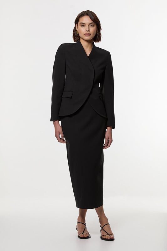 This Karen Millen tailored midi pencil skirt offers the perfect balance of sophistication and practicality for your everyday wardrobe. The compact stretch fabric moulds to your silhouette whilst ensuring all-day comfort and ease of movement. Style with a crisp sleeveless top and strappy sandals for a refined daytime look, or pair with a structured blazer for an effortlessly stylish ensemble perfect for family gatherings or lunch with friends. The functional pocket detail adds a contemporary touch to this timeless piece, whilst the below-knee length creates a flattering line that works brilliantly with both flats and low heels. This versatile skirt can be dressed down with a casual knit and trainers for weekend brunches or styled with a silk blouse for more polished daywear occasions.  Sleek midi pencil skirt Practical side pocket detail Elegant midi length Versatile design