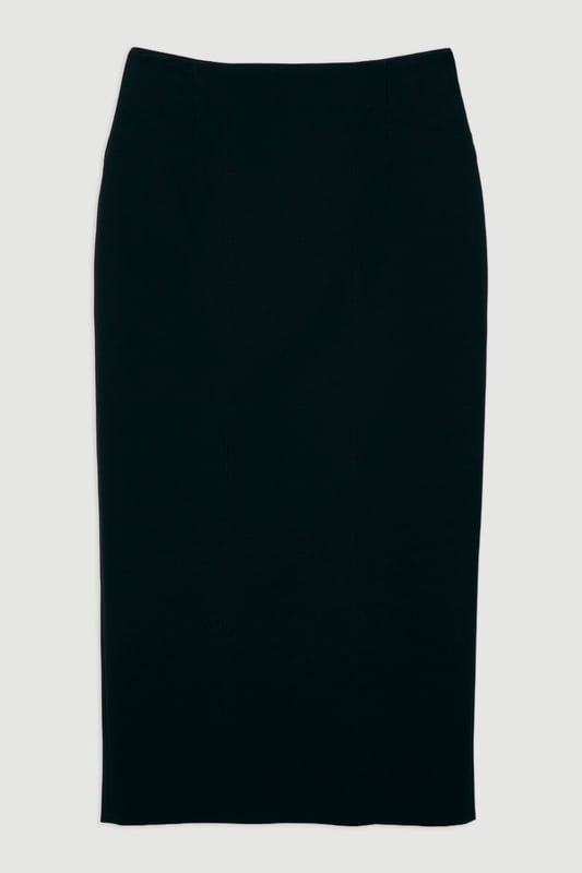 This Karen Millen tailored midi pencil skirt offers the perfect balance of sophistication and practicality for your everyday wardrobe. The compact stretch fabric moulds to your silhouette whilst ensuring all-day comfort and ease of movement. Style with a crisp sleeveless top and strappy sandals for a refined daytime look, or pair with a structured blazer for an effortlessly stylish ensemble perfect for family gatherings or lunch with friends. The functional pocket detail adds a contemporary touch to this timeless piece, whilst the below-knee length creates a flattering line that works brilliantly with both flats and low heels. This versatile skirt can be dressed down with a casual knit and trainers for weekend brunches or styled with a silk blouse for more polished daywear occasions.  Sleek midi pencil skirt Practical side pocket detail Elegant midi length Versatile design