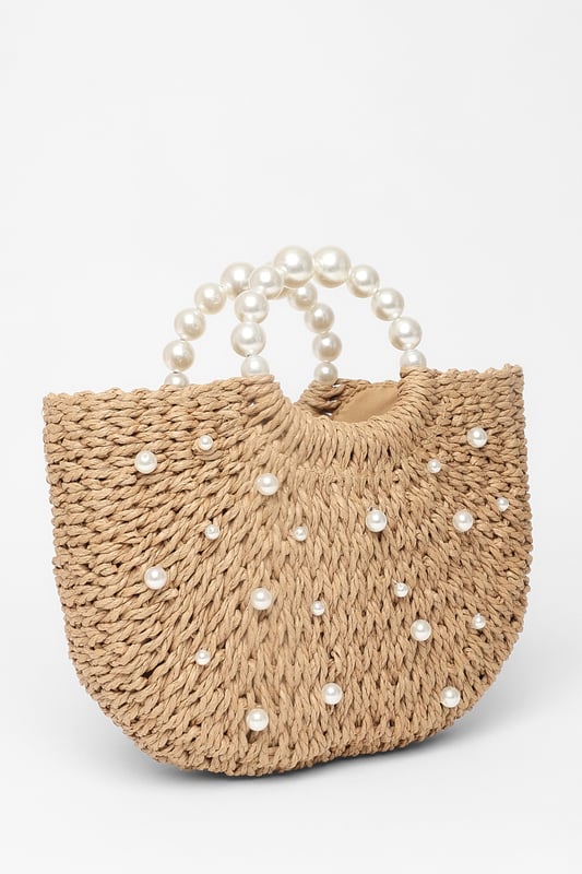 - Woven finish - Pearl details - Top handle - Lined - Exterior: 100% paper; excluding trims - Lining: 100% polyester