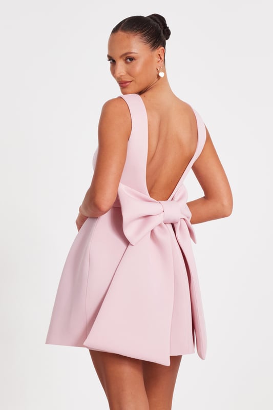 - Square neck - Large bow detail - Low back - Skate style - Model height: 5'6" - Model wears uk 8 / us 4 / eur 36 - Always check the wash care label - Cool hand wash with mild detergent