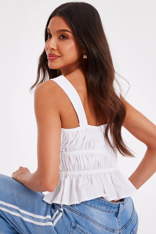 - Scoop neckline - Tie front - Cropped fit - Cami straps - Model height: 5'7" - Model wears uk 8 / us 4 / eur 36 - Always check the wash care label - Cool hand wash with mild detergent