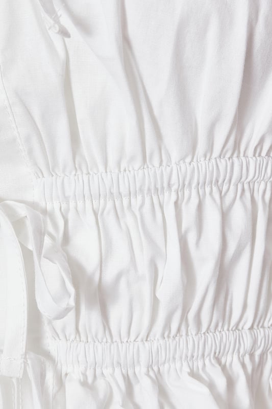 - Scoop neckline - Tie front - Cropped fit - Cami straps - Model height: 5'7" - Model wears uk 8 / us 4 / eur 36 - Always check the wash care label - Cool hand wash with mild detergent