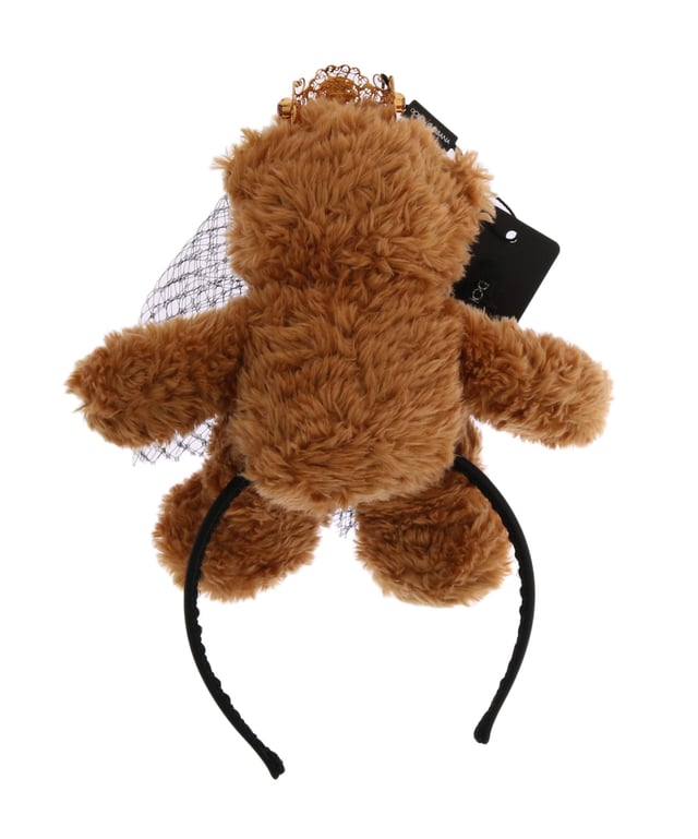 Stunning Dolce & Gabbana Teddy Bear Crystal Crown Hair Band
  100% Authentic and brand new with tags
  Brown color with gold metal detailing
  Crown adorned with red crystals
  Made from 80% PL 5% Crystal and 15% Brass
  One size fits all
  Dolce & Gabbana logo details
  Made in Italy
  Very exclusive and rare item
Material: 80% PL 5% Crystal 15% Brass
