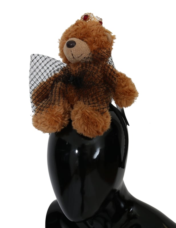 Stunning Dolce & Gabbana Teddy Bear Crystal Crown Hair Band
  100% Authentic and brand new with tags
  Brown color with gold metal detailing
  Crown adorned with red crystals
  Made from 80% PL 5% Crystal and 15% Brass
  One size fits all
  Dolce & Gabbana logo details
  Made in Italy
  Very exclusive and rare item
Material: 80% PL 5% Crystal 15% Brass