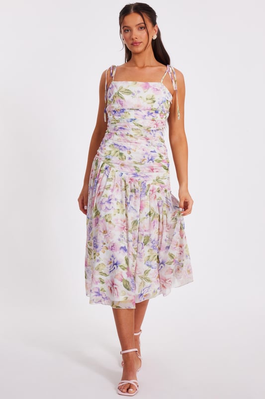 - Chiffon finish - Floral print - Ruched bodice - Drop waist look - Asymmetric waistline - Tie straps - Model height: 5'3" - Model wears uk 8 / us 4 / eur 36 - Always check the wash care label - Cool hand wash with mild detergent