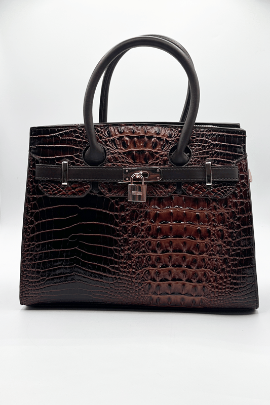 Stay stylish while running errands with this sleek messenger-style bag, featuring a top handle and an adjustable crossbody strap for added versatility. With multiple compartments to keep your essentials organised, this bag combines practicality with elegance. A front belt buckle and padlock detail add a chic, sophisticated touch.
L: 30cm W:12 H:23
Top Handle Height: 11cm
Adjustable strap
Colour: Black
SKU:HB350906
