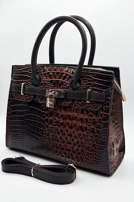 Stay stylish while running errands with this sleek messenger-style bag, featuring a top handle and an adjustable crossbody strap for added versatility. With multiple compartments to keep your essentials organised, this bag combines practicality with elegance. A front belt buckle and padlock detail add a chic, sophisticated touch.
L: 30cm W:12 H:23
Top Handle Height: 11cm
Adjustable strap
Colour: Black
SKU:HB350906