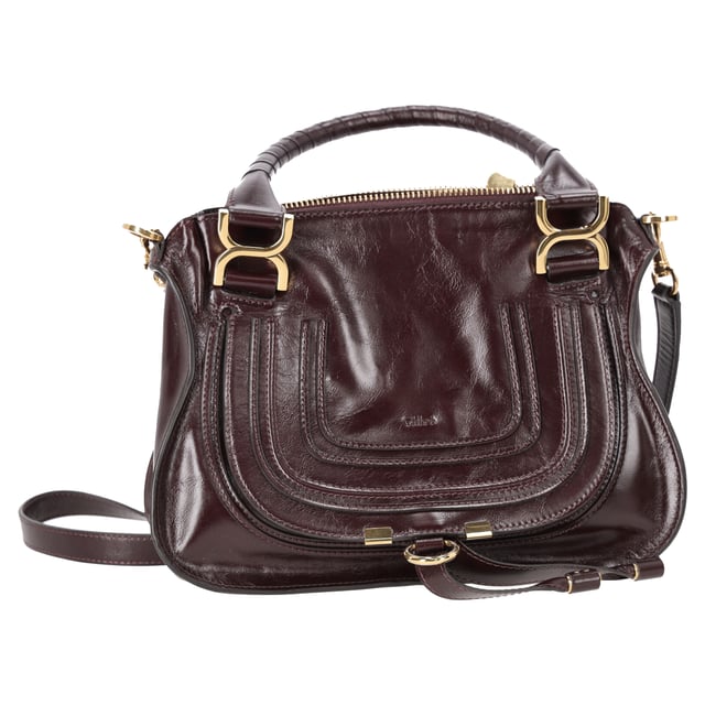 VINTAGE, RRP AS NEW
The Small Marcie Bag by Chloé is a graceful blend of structure and softness, crafted from luxurious shiny burgundy calfskin. Its gently slouched silhouette is accented with intricate saddle stitching, signature gold-tone hardware, and hand-wrapped double handles. The flap is secured with the line’s signature leather tassels, adding a touch of free-spirited charm to a refined classic.


Chloé Small Marcie Bag in Shiny Burgundy Leather
Condition: Very good
Signs of wear: No retail tag, No visible sign of wear., Lightly used but very well maintained. Minor creasing, light worn corners, light scratches.
Packaging: Dust bag
Color: Red | burgundy
Material: Leather | ] leather
Size: One Size | One Size
Measurements: Width: 90; Height: 220; Length: 310; Handle drop: 150; Strap length: 940
SKU: NAPPUDEBA527519W