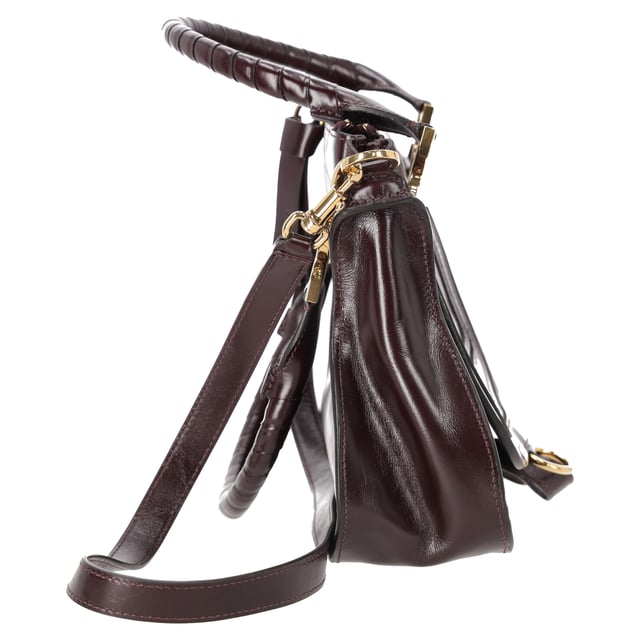 VINTAGE, RRP AS NEW
The Small Marcie Bag by Chloé is a graceful blend of structure and softness, crafted from luxurious shiny burgundy calfskin. Its gently slouched silhouette is accented with intricate saddle stitching, signature gold-tone hardware, and hand-wrapped double handles. The flap is secured with the line’s signature leather tassels, adding a touch of free-spirited charm to a refined classic.


Chloé Small Marcie Bag in Shiny Burgundy Leather
Condition: Very good
Signs of wear: No retail tag, No visible sign of wear., Lightly used but very well maintained. Minor creasing, light worn corners, light scratches.
Packaging: Dust bag
Color: Red | burgundy
Material: Leather | ] leather
Size: One Size | One Size
Measurements: Width: 90; Height: 220; Length: 310; Handle drop: 150; Strap length: 940
SKU: NAPPUDEBA527519W