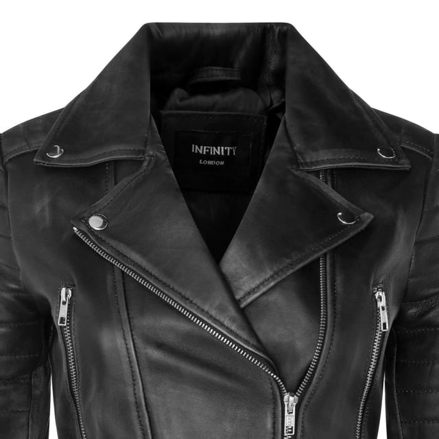 Indulge in sleek luxury with this cropped Brando-style leather jacket. Crafted from ultra-soft lamb nappa leather and lined with premium satin, it blends timeless biker attitude with modern elegance. Sophisticated detailing and a flattering silhouette make it a versatile essential for every fashion-forward wardrobe.

Key Features:
Soft and supple lamb nappa leather
Premium polyester inner lining for comfort
Cropped fit for a chic, flattering look
Classic Brando-style notched lapel
Off-centered YKK zip front fastening
Stylish quilted shoulders for a distinctive edge
2 outer extended vertical zipped pockets
Zipped cuffs – roll them up for a custom look
Buckle-adjustable side belts for a tailored fit