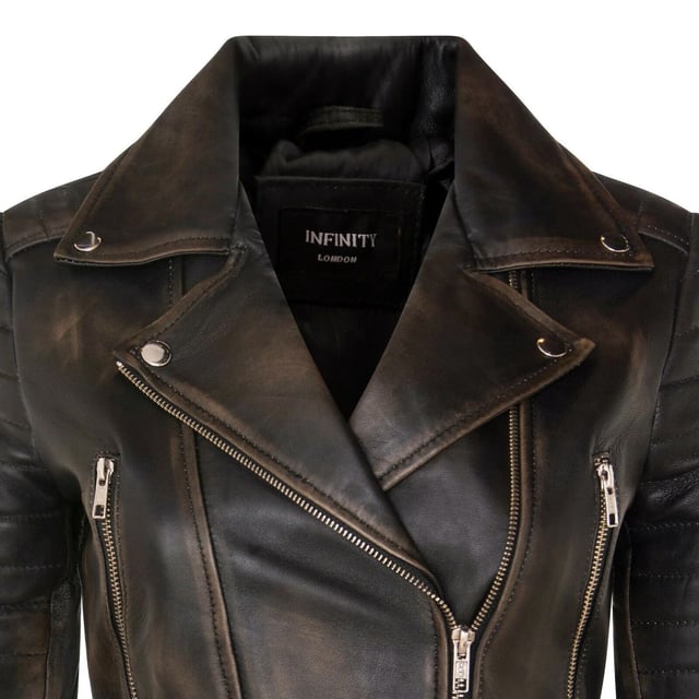 Indulge in sleek luxury with this cropped Brando-style leather jacket. Crafted from ultra-soft lamb nappa leather and lined with premium satin, it blends timeless biker attitude with modern elegance. Sophisticated detailing and a flattering silhouette make it a versatile essential for every fashion-forward wardrobe.

Key Features:
Soft and supple lamb nappa leather
Premium polyester inner lining for comfort
Cropped fit for a chic, flattering look
Classic Brando-style notched lapel
Off-centered YKK zip front fastening
Stylish quilted shoulders for a distinctive edge
2 outer extended vertical zipped pockets
Zipped cuffs – roll them up for a custom look
Buckle-adjustable side belts for a tailored fit
