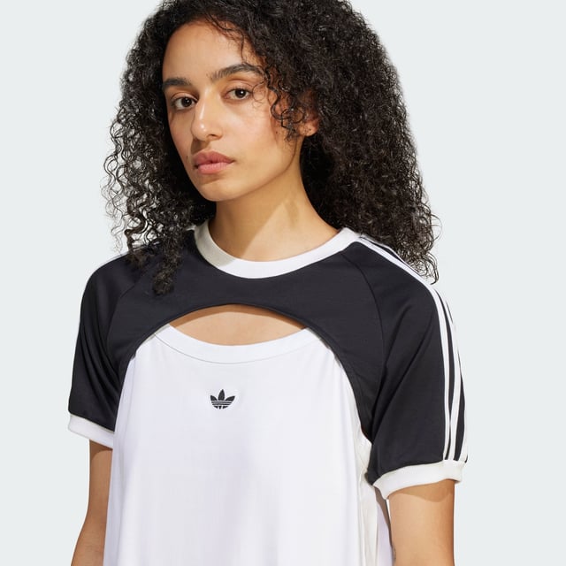 The adidas Originals R3CD Cali Tee goes for a more casual, laid-back aesthetic. Encouraging play with your style, there are two layers in one — first the tank top with details that call on the '90s and early aughts, then the over layer which can easily be mixed and matched with other pieces in your wardrobe. The back of the tank top is crafted with pleated woven fabric, while the front is a classic ribbed material.  - Slim fit - Part A: Ribbed crewneck - 53% cotton, 47% polyester (recycled) - Part A: Ribbed cuffs - Two-piece construction  Shipped by adidas