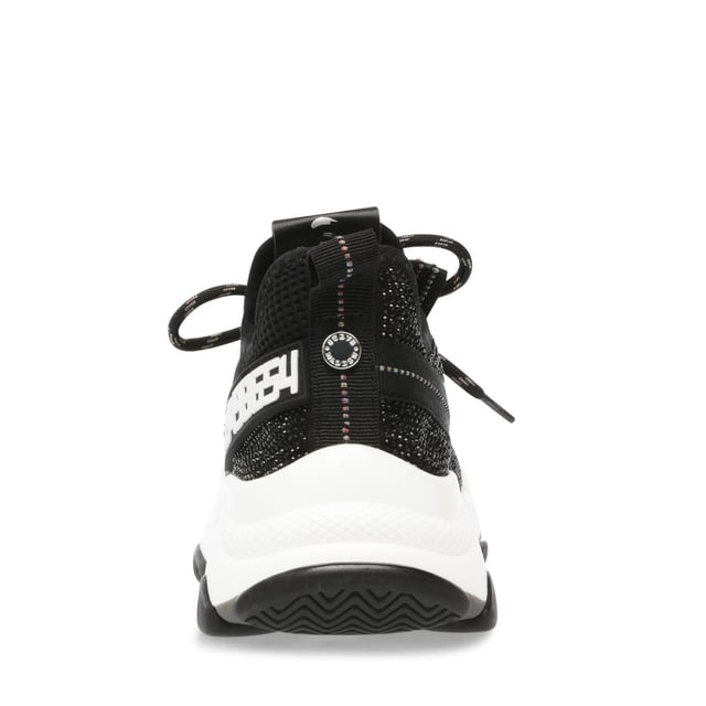 If you only rock one trainer this season  make it MAXILLA-R-E. A super-sleek monochromatic color palette unites this kick’s defining features  which range from a texture-blocked knit upper to an artfully sculpted sole and glitzy rhinestone embellishment.