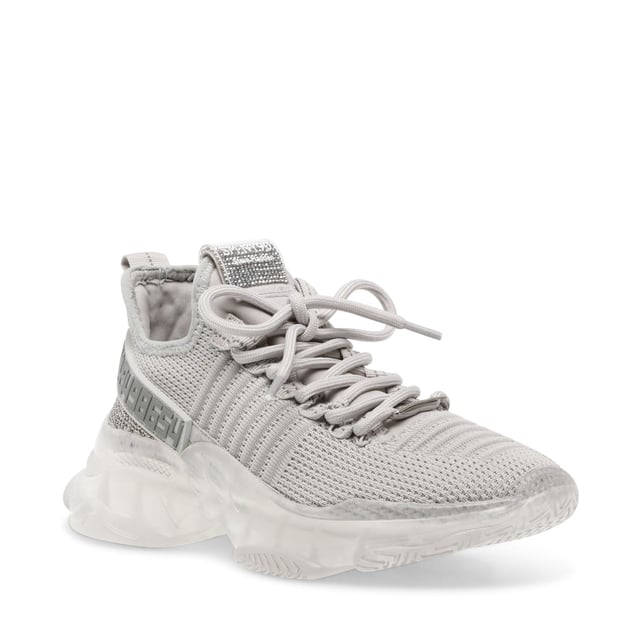 If you only rock one trainer this season  make it MAXILLA-R-E. A super-sleek monochromatic color palette unites this kick’s defining features  which range from a texture-blocked knit upper to an artfully sculpted sole and glitzy rhinestone embellishment.