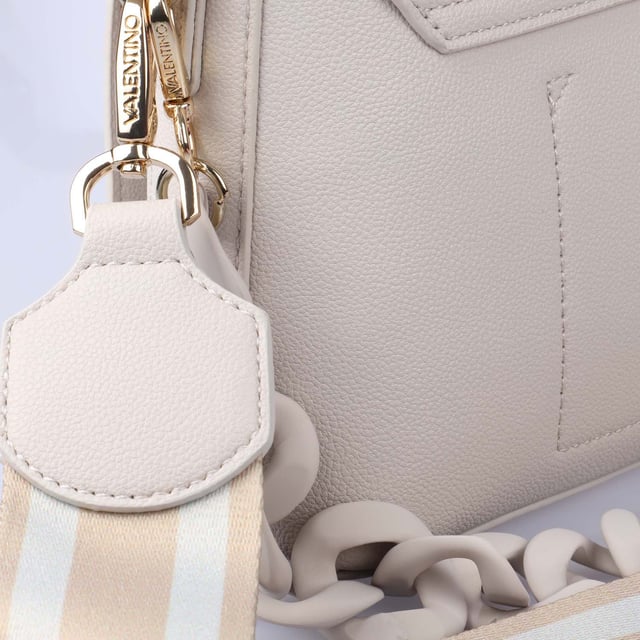 Magnetic Snap Fastening.Concealed Top Zip.Inner Slot Pocket.Detachable Logo Strap.Detachable Link Chain Strap.Raised Logo.Valentino Bags Branding.Gold Tone Hardware.Textured PU.